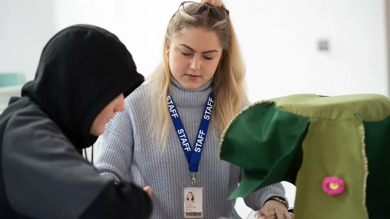 Child working through 11 Plus preparation materials with a tutor
